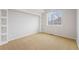 Spacious bedroom with built-in shelves and neutral decor at 12826 W Brittany Dr, Littleton, CO 80127