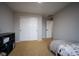 Charming bedroom with a twin bed and built-in shelving at 12826 W Brittany Dr, Littleton, CO 80127