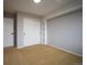 Simple bedroom with closet and neutral wall color at 12826 W Brittany Dr, Littleton, CO 80127