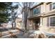 Two-story townhouse with stone exterior and walkway at 12826 W Brittany Dr, Littleton, CO 80127