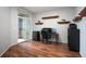 Bright home office with wood floors, built-in shelves, and patio access at 12826 W Brittany Dr, Littleton, CO 80127