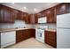Functional kitchen with ample cabinet space, modern appliances, and bright lighting at 12826 W Brittany Dr, Littleton, CO 80127
