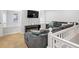 Comfortable loft area with sectional sofa and TV at 12826 W Brittany Dr, Littleton, CO 80127