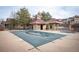 Community pool covered for winter with nearby restrooms at 12826 W Brittany Dr, Littleton, CO 80127