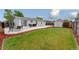 Lush backyard boasts a well-maintained lawn, a patio with outdoor seating, and a storage shed at 687 Prairie Ave, Brighton, CO 80603