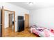 This room shows a bed, dresser, and natural light, offering comfort and functionality at 687 Prairie Ave, Brighton, CO 80603