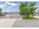 Charming home featuring a well-maintained front yard, healthy tree, and inviting exterior paint at 687 Prairie Ave, Brighton, CO 80603
