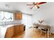 Eat-in kitchen showing bright cabinets and natural light at 687 Prairie Ave, Brighton, CO 80603