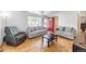 Spacious living room with hardwood floors, vaulted ceilings, and a cozy seating area at 687 Prairie Ave, Brighton, CO 80603