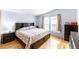 Comfortable bedroom with hardwood floors, natural light, and ample closet space at 687 Prairie Ave, Brighton, CO 80603