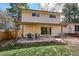 Back of house with large sliding glass doors and covered patio at 13183 Spica Dr, Lone Tree, CO 80124