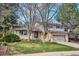 Charming two-story home with a well-manicured lawn and attached garage at 13183 Spica Dr, Lone Tree, CO 80124