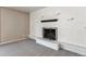 A modern living room featuring a painted white brick fireplace with mantle at 13183 Spica Dr, Lone Tree, CO 80124