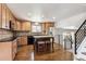 Modern kitchen with an island, stainless steel appliances, and ample cabinet space, perfect for culinary enthusiasts at 13183 Spica Dr, Lone Tree, CO 80124