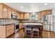Well-equipped kitchen featuring an island, stainless steel appliances, and stylish cabinetry for a modern feel at 13183 Spica Dr, Lone Tree, CO 80124