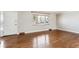 Bright and airy living room with hardwood floors and a large window at 13183 Spica Dr, Lone Tree, CO 80124