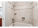 Shower features designer tile, recessed storage niche and bathtub at 13183 Spica Dr, Lone Tree, CO 80124