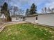 Spacious backyard with a patio and lush green grass, perfect for outdoor living at 2900 S Downing St, Englewood, CO 80113