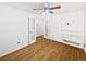 This bedroom offers a ceiling fan, closet and a window that provides plenty of natural light, and refinished floors at 2900 S Downing St, Englewood, CO 80113
