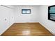Clean and simple bedroom space with natural light and hardwood floors at 2900 S Downing St, Englewood, CO 80113