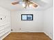 This bedroom offers a ceiling fan, closet and a window that provides plenty of natural light, and updated flooring at 2900 S Downing St, Englewood, CO 80113