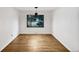 Bright dining room with refinished hardwood flooring, neutral walls, and updated lighting perfect for gathering at 2900 S Downing St, Englewood, CO 80113