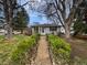 Charming single-story home with a well-manicured front yard and inviting walkway at 2900 S Downing St, Englewood, CO 80113