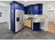 Stylish kitchen with blue cabinets, stainless steel appliances, and modern countertops at 2900 S Downing St, Englewood, CO 80113