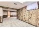 This is a view of a large basement with decorative paneling, carpet, and an open design at 13940 E Linvale Pl, Aurora, CO 80014