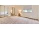 Cozy carpeted bedroom featuring a mirrored closet at 13940 E Linvale Pl, Aurora, CO 80014