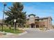 Stunning exterior view of a modern building with stone accents, manicured landscaping, and a welcoming entrance at 13940 E Linvale Pl, Aurora, CO 80014
