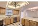 Kitchen with stainless steel dishwasher and view of dining room at 13940 E Linvale Pl, Aurora, CO 80014
