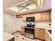 Functional kitchen with stainless steel appliances at 13940 E Linvale Pl, Aurora, CO 80014