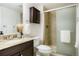 Bathroom with granite countertop and a glass-enclosed shower at 3452 S Eagle St # 101, Aurora, CO 80014