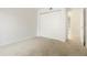 Neutral bedroom featuring closet with sliding doors at 3452 S Eagle St # 101, Aurora, CO 80014