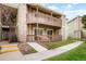 Inviting condo with private balconies, stone accents, and well-maintained landscaping at 3452 S Eagle St # 101, Aurora, CO 80014