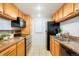 Functional kitchen featuring stainless steel appliances, granite countertops, and ample cabinet space at 3452 S Eagle St # 101, Aurora, CO 80014
