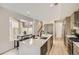 Bright kitchen featuring a large island, stainless appliances, and lots of natural light at 2313 S High St, Denver, CO 80210