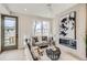 Comfortable living room featuring a modern fireplace and stylish decor at 2313 S High St, Denver, CO 80210