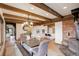 Large dining room features exposed wood beam ceilings at 34127 Cactus Dr, Evergreen, CO 80439