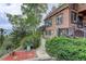 Charming home featuring stone accents, wood siding, and a beautiful, landscaped front yard at 34127 Cactus Dr, Evergreen, CO 80439