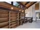 Bright home office featuring built-in shelving, exposed beam ceilings, and natural light at 34127 Cactus Dr, Evergreen, CO 80439