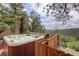 Outdoor hot tub offering scenic views of the surrounding natural beauty, providing a tranquil retreat at 34127 Cactus Dr, Evergreen, CO 80439