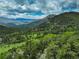 Expansive mountain view showcasing the stunning landscape and natural beauty of the area at 34127 Cactus Dr, Evergreen, CO 80439