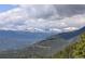 Distant snow-capped mountains and valley views at 34127 Cactus Dr, Evergreen, CO 80439