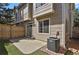 This backyard has synthetic turf, a concrete patio and attractive brown wood siding at 1356 Carlyle Park Cir, Highlands Ranch, CO 80129