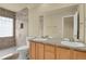 Bathroom featuring double sinks and a spacious tile shower at 1356 Carlyle Park Cir, Highlands Ranch, CO 80129