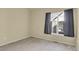 Bedroom with a window and neutral colored carpet at 1356 Carlyle Park Cir, Highlands Ranch, CO 80129