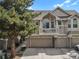 Charming townhouse featuring a private balcony, multi-car garage, and welcoming curb appeal at 1356 Carlyle Park Cir, Highlands Ranch, CO 80129