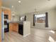 Well-lit kitchen flows into adjacent living area, creating an open floor plan at 1356 Carlyle Park Cir, Highlands Ranch, CO 80129